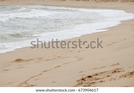 Beautiful Soft wave of blue ocean on sandy beach. Background