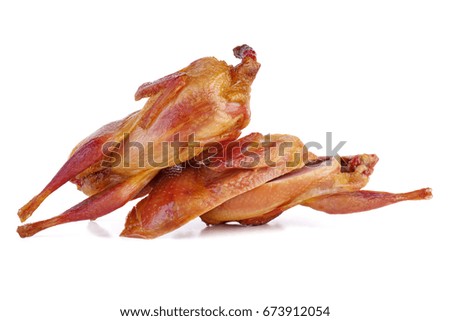 Smoked quails - whole and cut on half isolated on white background