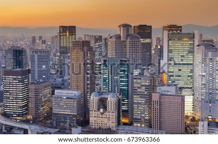Business downtown building Osaka city after sunset tone background, Japan