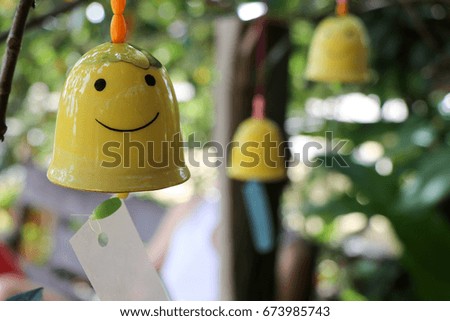 Ceramic bells with smiling faces