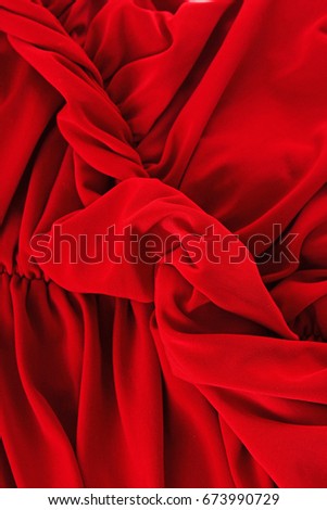 Silk dress material cloth texture pattern. 
tailoring stitching concept. Shiny beautiful fashion fabric. Shiny clothing material sample.Creased fabric. Red silk dress.
