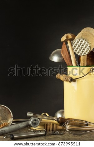 Kitchen tools on a wooden table. Cook's tools. Traditional equipment of rural cuisine