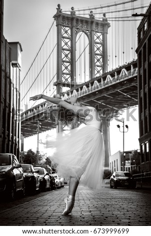Elegant ballet dancer woman dancing ballet in the city