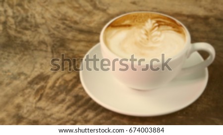 Out of focus the hot cappuccino or latte art coffee, blur and abstract background.