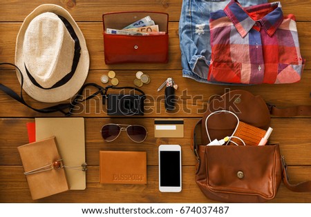 Journey planning, tourist essentials set top view. Preparing for travel, flat lay of traveller baggage, blank smartphone screen, copy space