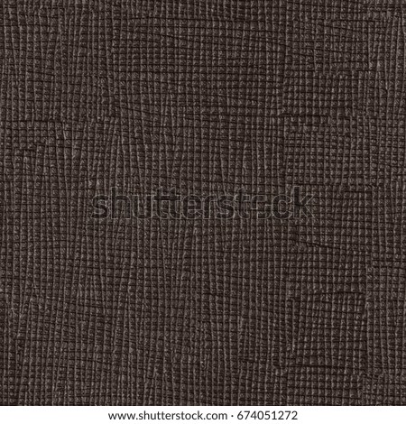 Texture of dark brown leather on macro. Seamless square background, tile ready. High resolution photo.