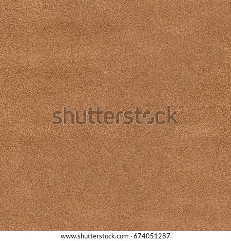 Close up of a orange leather texture. Seamless square background, tile ready. High resolution photo.