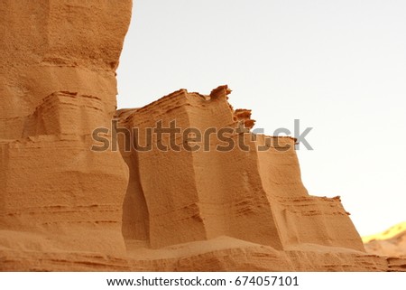 Side view of sandy beach. Background with copy and visible sand texture