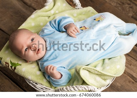 Baby lying on cloth. Top view of infant. Children are our future.