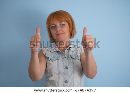 Girl showing thumb up, OK
