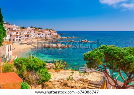 Sea landscape with Calella de Palafrugell, Catalonia, Spain near of Barcelona. Scenic fisherman village with nice sand beach and clear blue water in nice bay. Famous tourist destination in Costa Brava Royalty-Free Stock Photo #674086747