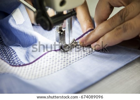 Textile Factory - Tailor working on sewing machine