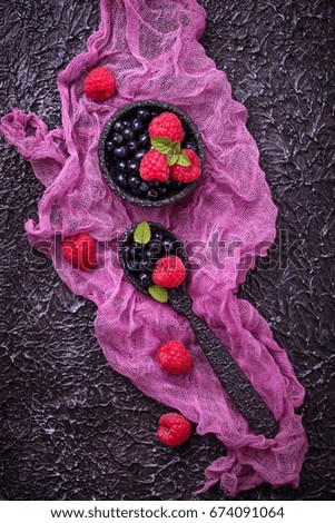 Fresh blueberries and raspberries. Selective focus