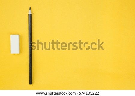 Stationery pencil black, eraser on Yellow paper, Prepared to take notes to remind you concept.