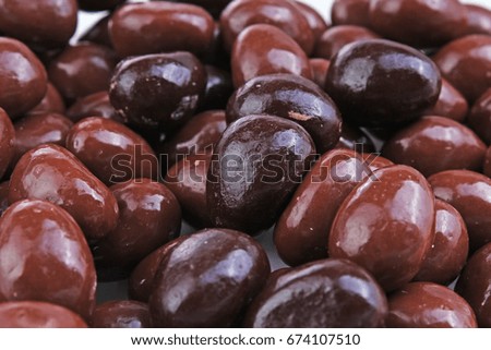 Dark and dairy chocolate balls.  Chocolate drops as background texture pattern. Bon bons.