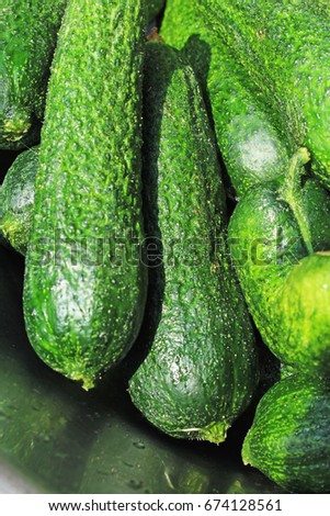 Raw Pickles as background. Green raw pickle texture pattern. 
pickled cucumber,

