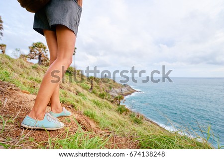 Tourism  and concept. Young traveling woman hiking with sea view.