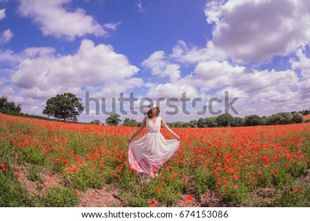 poppy fields in the summertime with a Filipino model