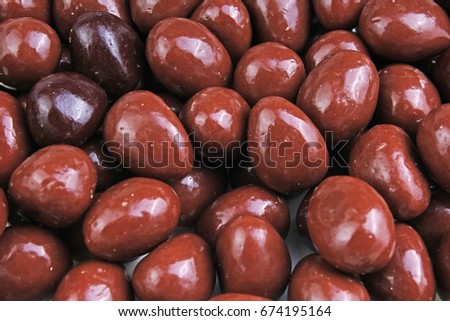 Dark and dairy chocolate balls eggs.  Chocolate drops as background texture pattern. Bon bons.
