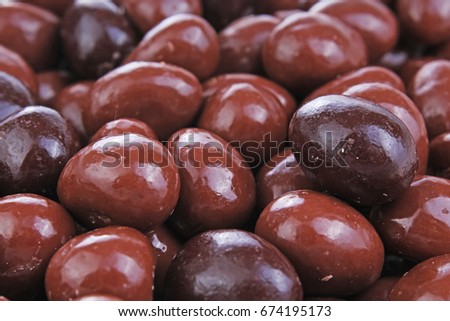 Dark and dairy chocolate balls eggs.  Chocolate drops as background texture pattern. Bon bons.
