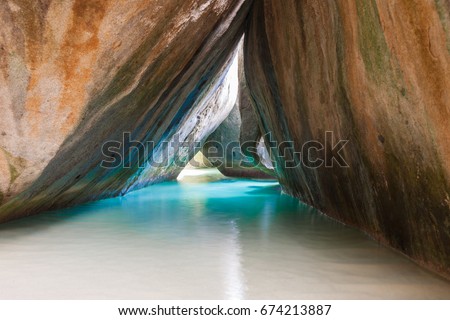 Famous beach and rock formation called The Bath on Virgin Gorda, British Virgin Islands Royalty-Free Stock Photo #674213887