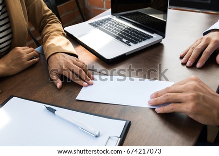 business man giving resignation letter to human resource manager