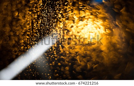 Abstract background of  blur gold lighting during raining