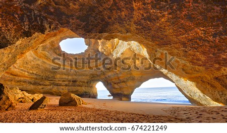 Benagil Cathedral at beautiful coast of Algarve, Portugal. Royalty-Free Stock Photo #674221249