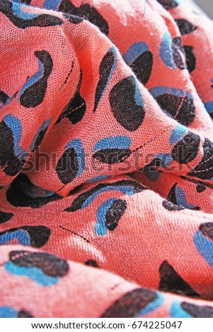 Leopard animal print pattern fabric cloth sample. 
wild animal pattern background or texture. Peach color.