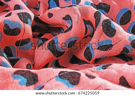 Leopard animal print pattern fabric cloth sample. 
wild animal pattern background or texture. Peach color.