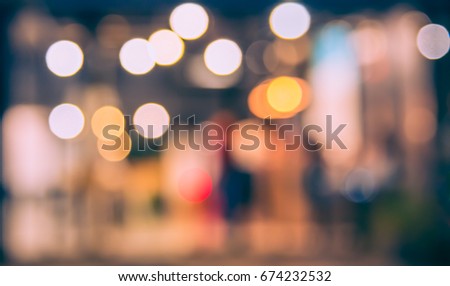 Image of Abstract Blur street night market with bokeh for background usage .(vintage tone)