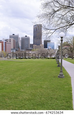 Downtown St. Paul with view of some of skyline seen from park. 