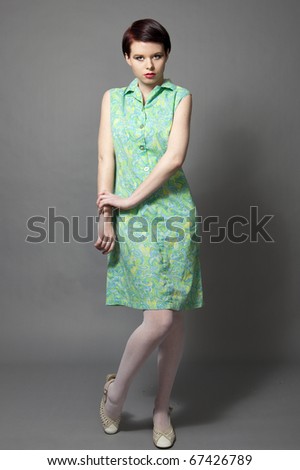 A beautiful you woman wearing a 60s dress