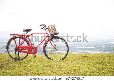 Red Japan style classic bicycle at the park, 
beautiful landscape image with Bicycle at sunset