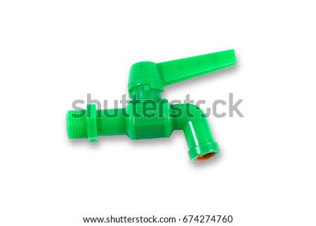 the green plastic faucet on white background