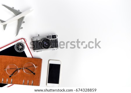 Business Travel Blogger accessories and object isolated on white copy space for Vacation poster and Banner, including mobile phone tablet camera plane compass and notebook. Royalty-Free Stock Photo #674328859