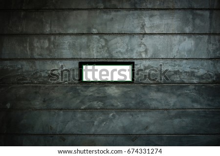  The white label on the cement wall is used for write the messages for tell everyone about this area. White label on cement wall. Label on cement background.