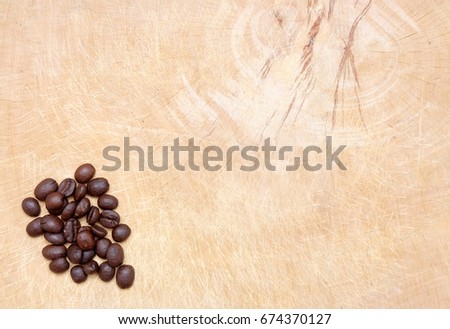 Coffee beans on wooden tray