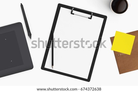 Modern office desk workplace with blank clip board, coffee cup and graphic tablet copy space on white desk background. Top view. Flat lay style.