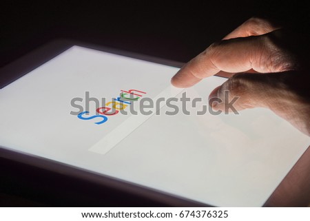 Search on internet search engine web on smart phone or tablet concept with night background