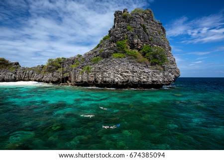 snorkeling diver swim at underwater with coral reef . Travel lifestyle, background Island and tropical beach, Koh Hayai Island, Andaman Sea , Thailand