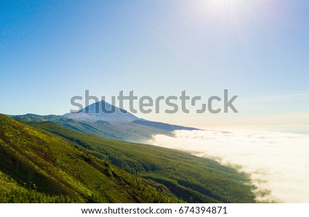 Aerial view of the Teide volcano above the clouds
