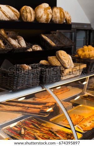 Delicious bread on the shelves in the bakery.