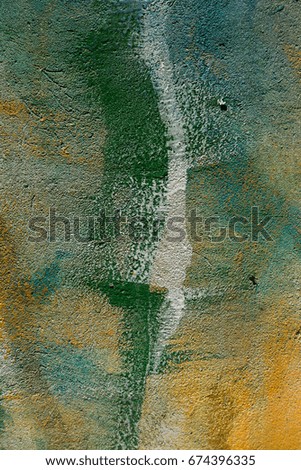 Abstract stains of paint on the wall. Abstract colored paint stains on a city wall. Stains and stains of bright paint on the wall of the building. Beautiful abstract street art