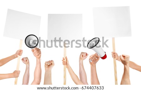 Raised human hands with megaphones and placards on white background. Strike and protest concept Royalty-Free Stock Photo #674407633
