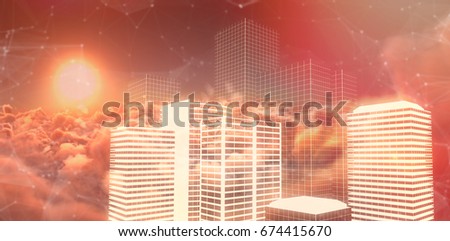 Digital composite image of buildings against scenic view of bright orange sun over cloudscape during sunset