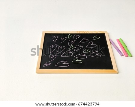 Drawing cartoon heart,colorful chalk spread on white background. 