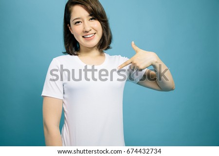 young woman showing plain white T shirt.