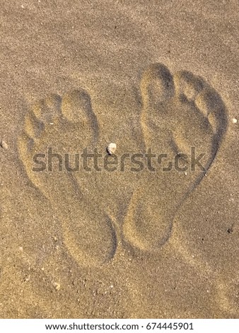 Footprint on the sand at night