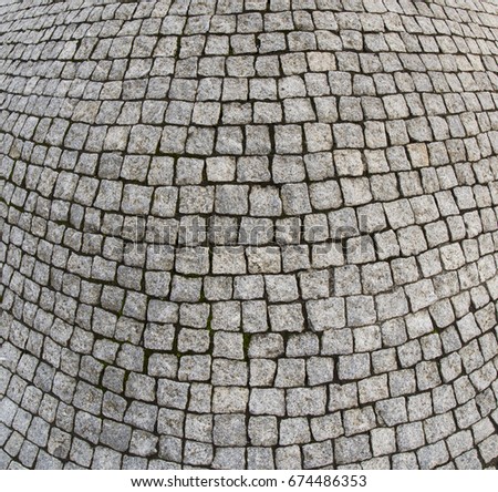 Cement tile curving outward into a bulge